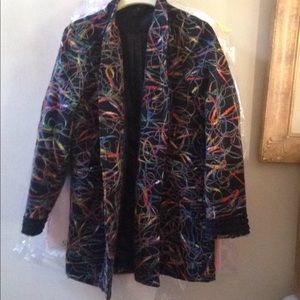 A beautiful black jacket with colorful yarn.
